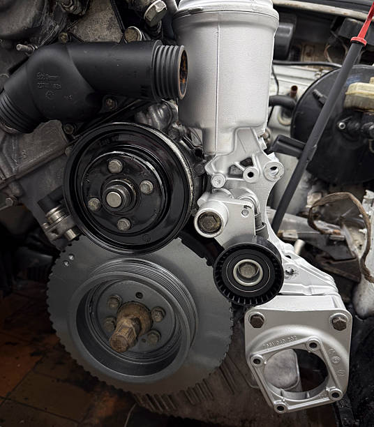 istock Close view of various engine parts working together in a mechanic's workshop 2252197189