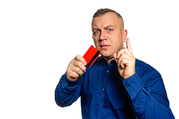 istock Man pointing finger warning with credit card 2252200508