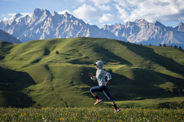 istock Trail runner running on the high altitude grassland mountain top 2252201906