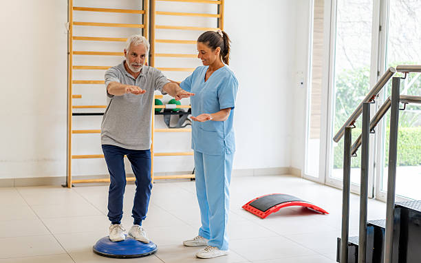 istock Senior man working on his balance in physical therapy 2252206215