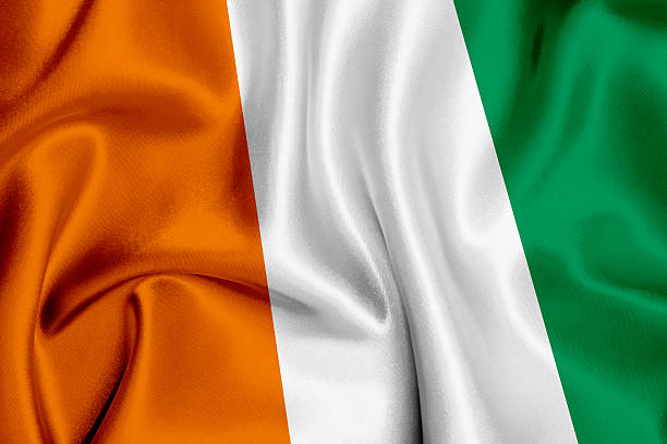Flag of Cote d'Ivoire waving background. (in West Africa)