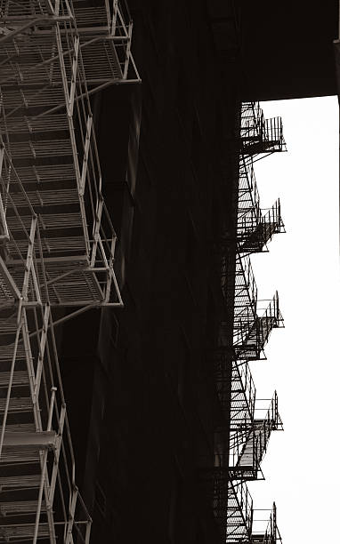 istock Abstract Contrast of Fire Escape Ladders 2252209302