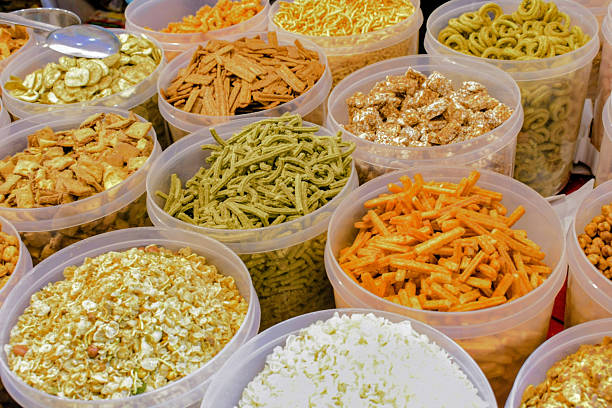 istock assorted indian snacks in plastic containers at market 2252209659