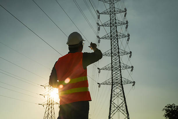istock Male Engineer Silhouette Checking Electrical Transmission System Safety 2252210779