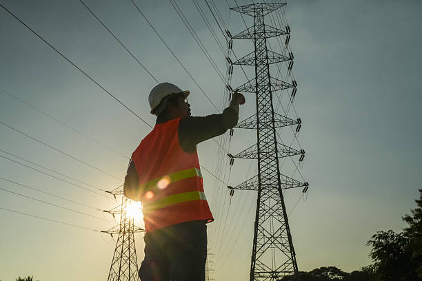 istock Male Engineer Silhouette Checking Electrical Transmission System Safety 2252210780