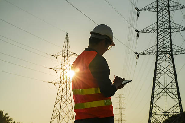 istock Male Engineer Silhouette Checking Electrical Transmission System Safety 2252210788