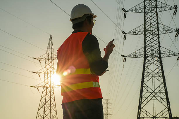 istock Male Engineer Silhouette Checking Electrical Transmission System Safety 2252210790