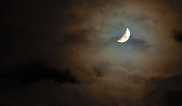 istock Moon that seems to be parting the clouds at night 2252210792
