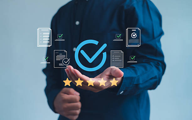 istock person presenting a digital quality assurance icon with check marks and five-star rating, symbolizing approval, certification, reliability, and high-standard performance in business services. 2252213009