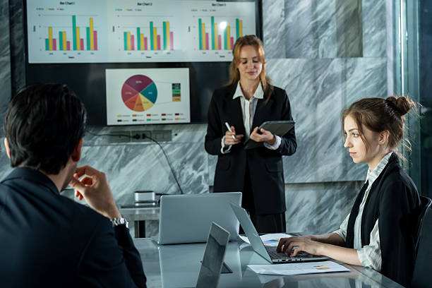 istock Caucasian female executive explaining sales report during business meeting while team listening attentively, collaborative environment inside modern office showing teamwork and analysis in progress 2252213970