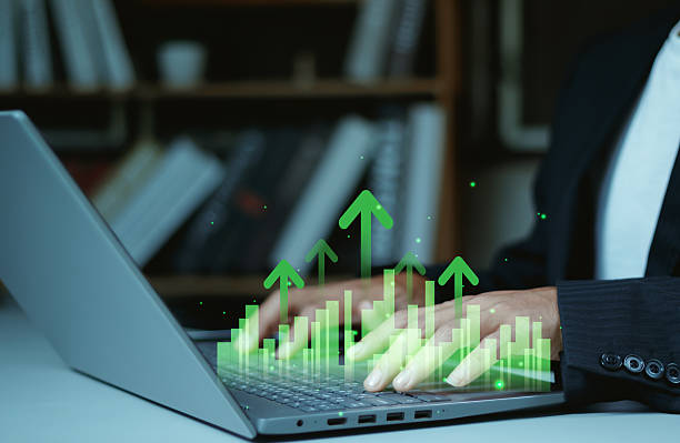 istock Progress or success concept, Business growth, Businessman use tablet showing a growing virtual hologram of analytics dashboard with charts, Stock market, Invest in trading, Finance, Marketing. 2252214151