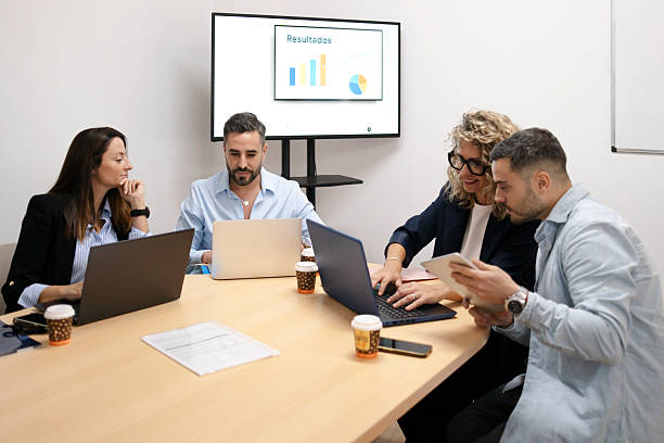 istock Business team analyzing results during office meeting 2252214251