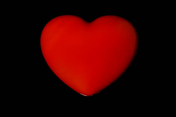 A heart shape rests next to an cowboy hat and a lasso.
