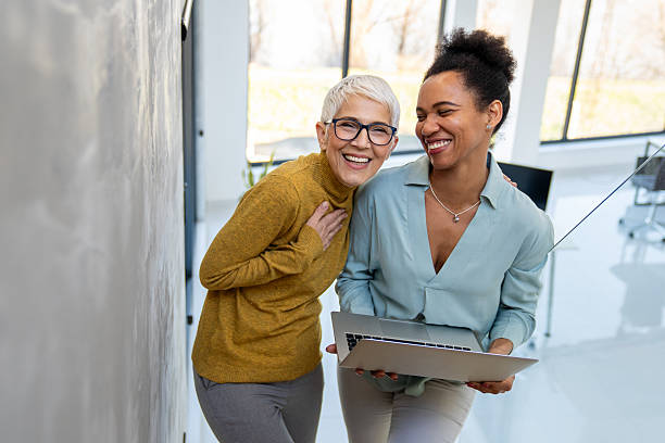istock Diverse business colleagues in office teamwork using laptop for collaboration, corporate success 2252216225