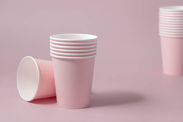 istock Disposable light pink paper cups closeup, mockup, copy space. No plastic biodegradable single-use 2252218624