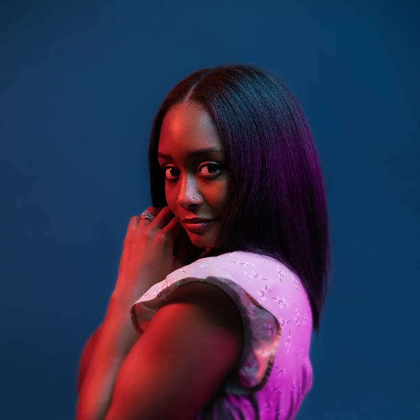 istock Mood Lit Beauty - Colorful Studio Portrait 2252222538
