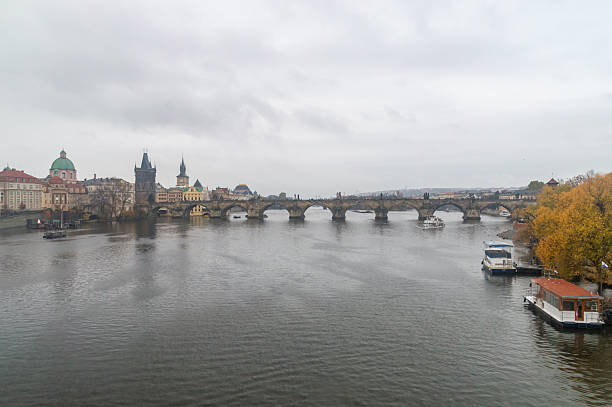 Prague, Czech Republic - November 9, 2025: Charles Bridge (Karluv most) at rainy day.