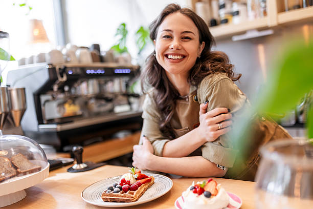 istock Woman Choosing Fresh Berry Desserts at Bakery 2252228902