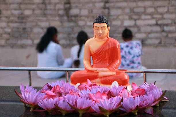 istock praying in buddhist temple 2252229141