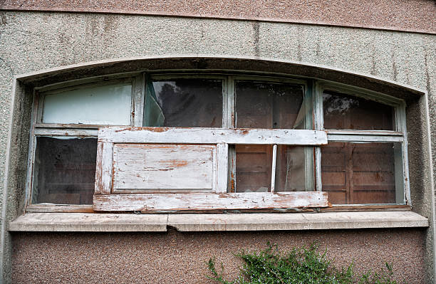 Old abandoned building exterior grunge texture with weathered window