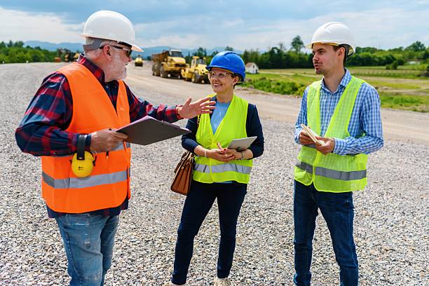 istock Engineers and investor on a road construction site 2252229803