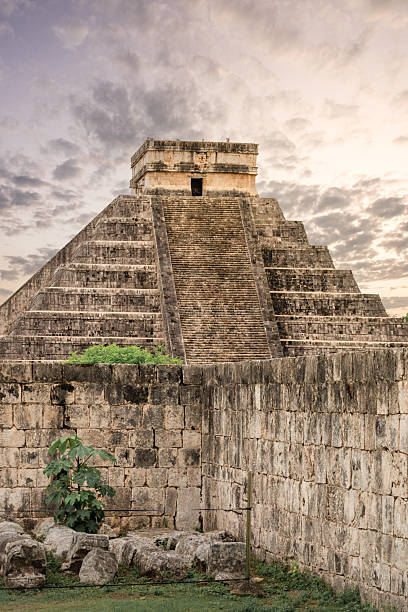 Chichen Itza from a distance with dramtatic sky. Sunset as a strom is rolling in.