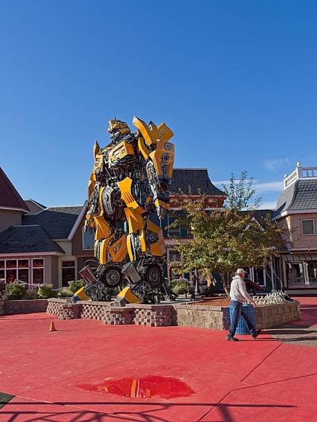 Mackinaw City, Michigan - USA, October 7, 2025. Man walks by transformer structure in outside Mackinaw City mall. Mackinaw City is the gateway to Mackinac island accessible by ferry a popular tourist vacation destination off the north end of lower Michigan. A long bridge extends north of Mackinaw City across the straits to the Upper Peninsula of Michigan.