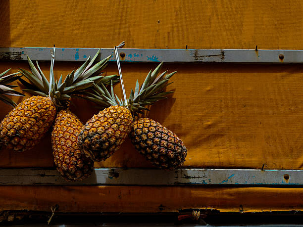 pineapples at the market in the back of a truck