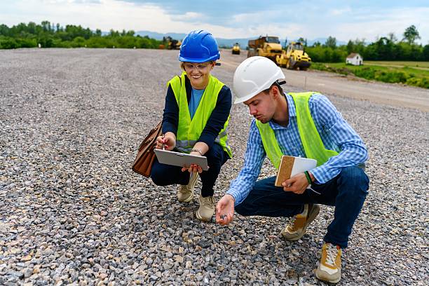 istock Engineer and investor on a road construction site 2252233630