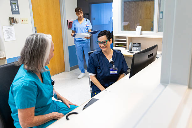 istock Nurses and doctors interacting the central hospital lobby 2252234290