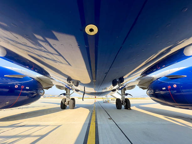 istock Low Angle Underside View of Commercial Jet with Landing Gear 2252234313