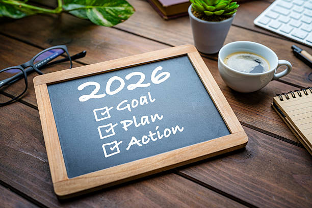 istock 2026 New Year resolutions on chalkboard on office or workplace desk. Goals, strategy, resolutions, target, plan, action, checklist for the coming year. 2252239558