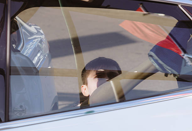 istock A guy washes a car door window with a rag. 2252241590