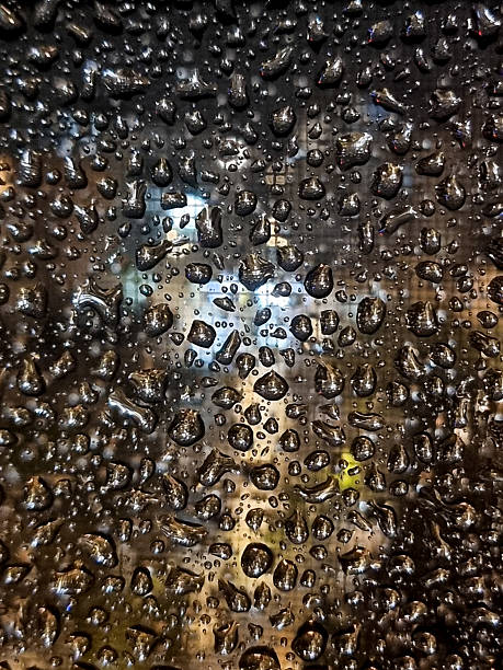 istock raindrops, rain on glass, water drops, wet window, rain, drop, abstract, macro, rainy weather, abstract background, glass texture, moisture, condensation, urban mood, city lights, bokeh, blurred background, night city, atmosphere, moody, melancholy, weath 2252244639