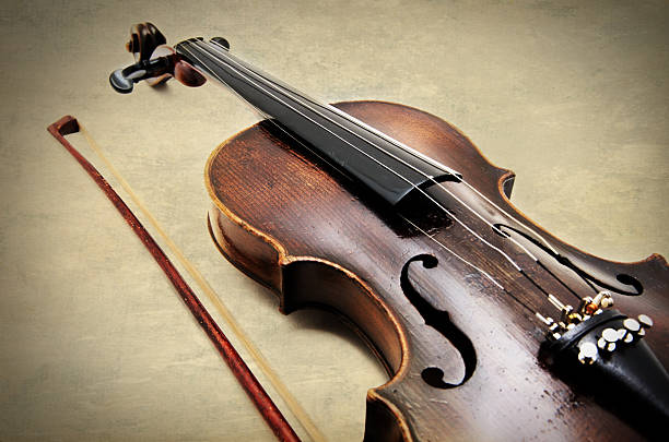 istock Classic violin on grunge paper texture. 2252246242