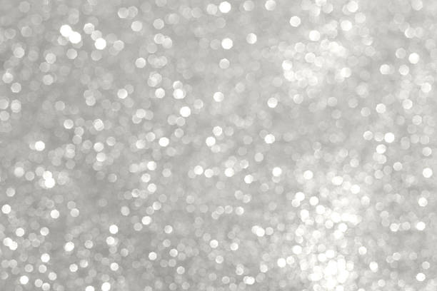 istock Shimmering silver bokeh background with glittery lights for celebration and stylish decor Demonstration Color of the Year 2026 2252255238