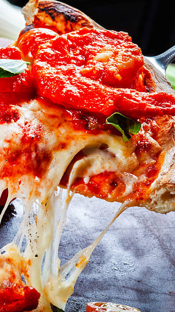 istock Shrimp pizza with cherry tomatoes, basil, and melted mozzarella cheese. 2252258260