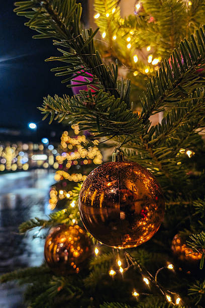 istock Christmas trees , decorations and lights in city 2252258759