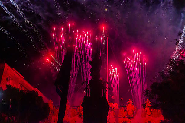Cospicua, Malta - December 7th, 2025, Vibrant Night Festival With Statue Procession, Fireworks, and Ornate Decor Amid a Crowded Celebration