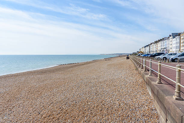 istock Empty pebble beach lined with a pedestrian and cycle lane on a sunny spring day 2252260181