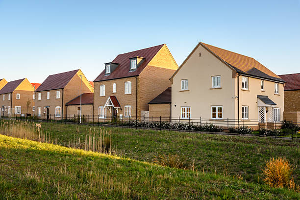 istock Suburban housing development under clear blue sky at sunset 2252260492