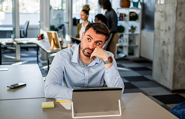 istock Tired businessman feeling burnout and stress in office 2252260522