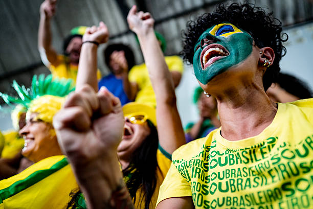 istock Brazilian fan cheering and celebrating while watching a soccer match 2252264139