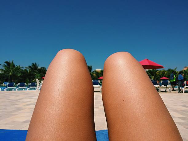 Carefree woman spend her holidays on tropical island near palm tree. Smart woman use mobile phone, shop online in internet. Woman tourist enjoy online shopping in tropical vacation. Look at screen