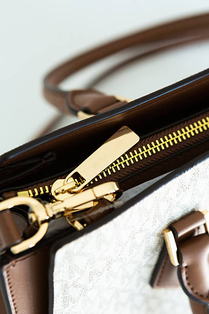 istock light leather bag with gold chain strap, minimalist design 2252266283