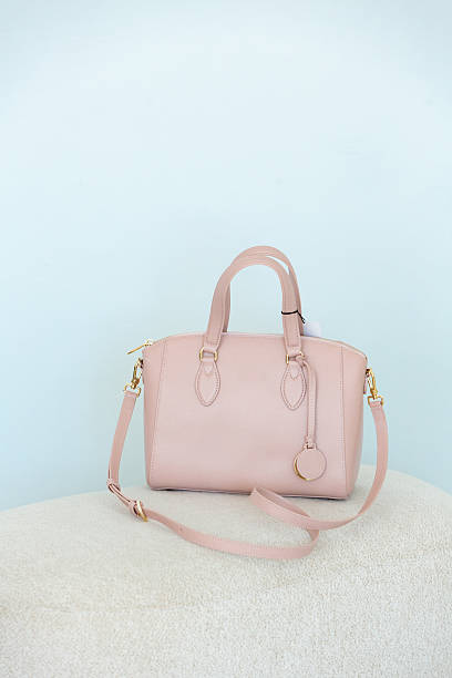 istock Light soft pink women's handbag on a pastel blue background. 2252268734