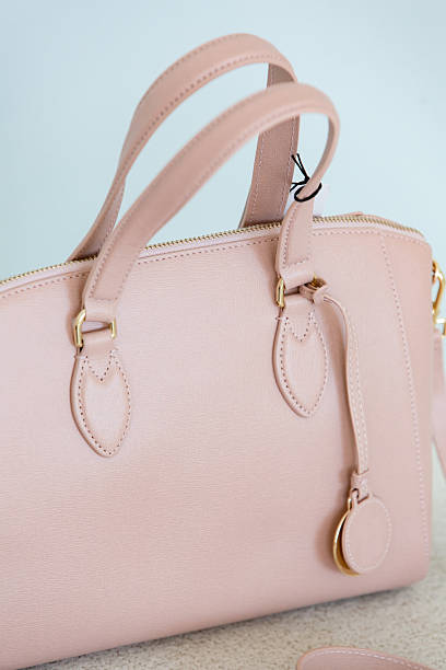 istock Light soft pink women's handbag on a pastel blue background. 2252268738