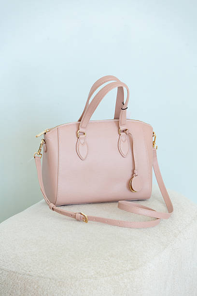 istock Light soft pink women's handbag on a pastel blue background. 2252268743