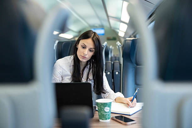 istock Woman Diligently Writing While Traveling 2252268817