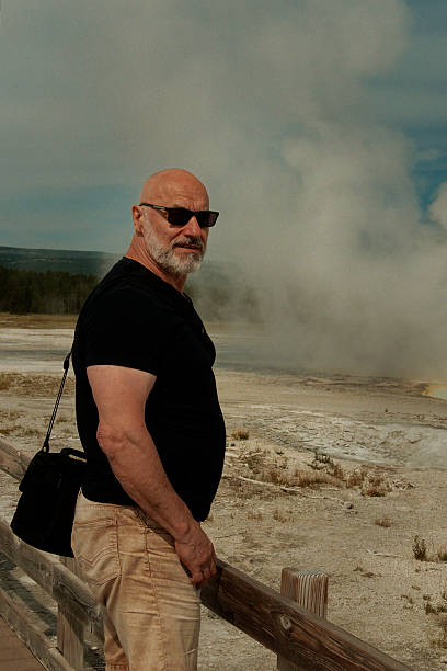 Outdoor Explorer Capturing Serene Geothermal Activity With Camera Equipment